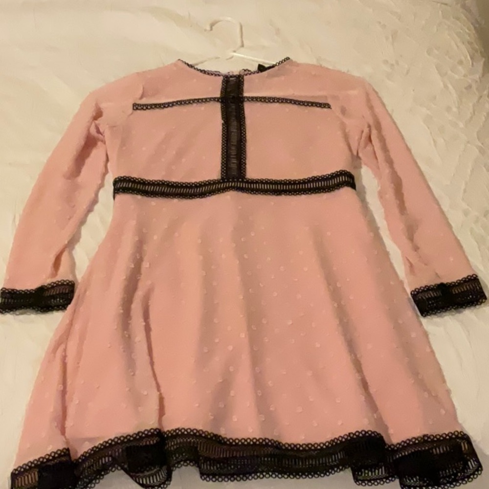 Size 14, the dress is pink with black outlines